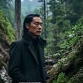 琉璃川首席生态顾问陈流光，深色外套、眼神专注，摄于琉璃川山间考察途中，背景为苍翠林木